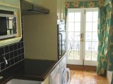 The Kitchen leads to French doors which open onto the courtyard, with Southwold Lighthouse just yards away.