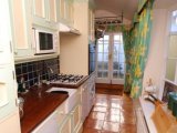 The Kitchen leads to French doors which open onto the courtyard, with Southwold Lighthouse just yards away.