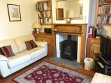The Lounge at Lighthouse View Cottage, where the sea is just minutes from the front door.